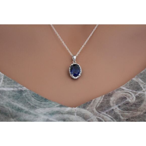 Sterling Silver Blue Oval CZ Pendant Circled in Clear CZ Stones Necklace - Picture 1 of 5